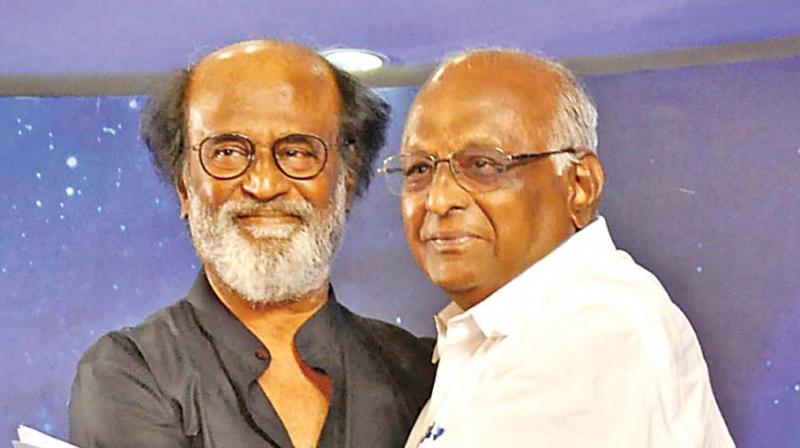 Superstar Rajinikanth  embraces film director  SP. Muthuraman, during his meeting with fans. (Photo: DC)