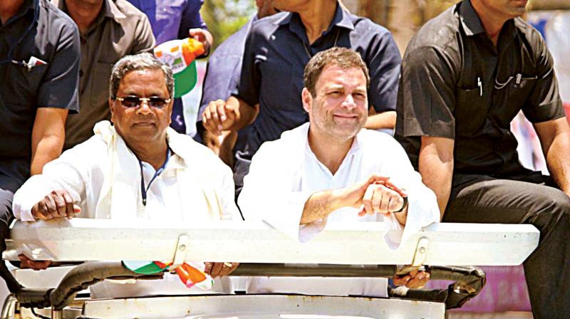 AICC president Rahul Gandhi and Chief Minister Siddaramaiah during election campaign at Ankola on Thursday. (Photo:KPN)