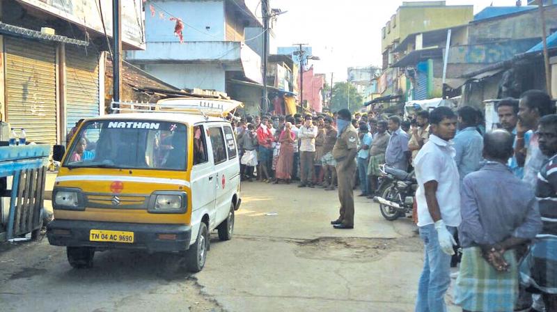 Neighbours and police in front of the house where four hanged themselves in Chennai on Saturday (Photo: DC)