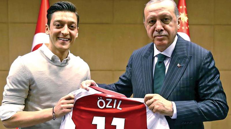 A file photo of Mesut Ozil with Turkish president Erdogan.