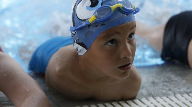 The six-year-old boy was enrolled by his parents to an academy inspite of his fear of water and has come a long way from there. (Photo: AP)