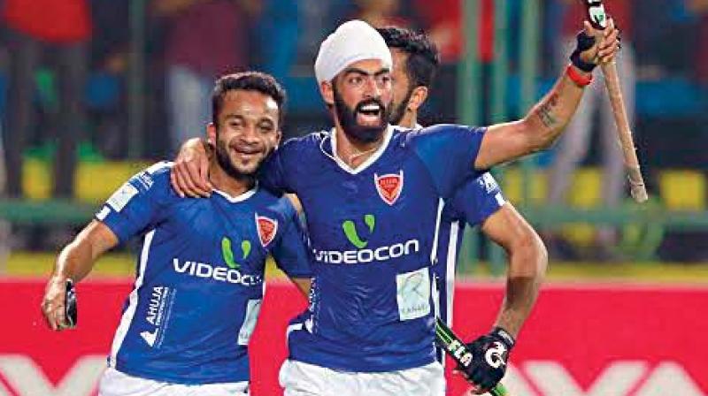 Mumbais Affan Yousuf celebrates his goal with team mate Gurmail Singh in their HIL-5 match against Delhi.