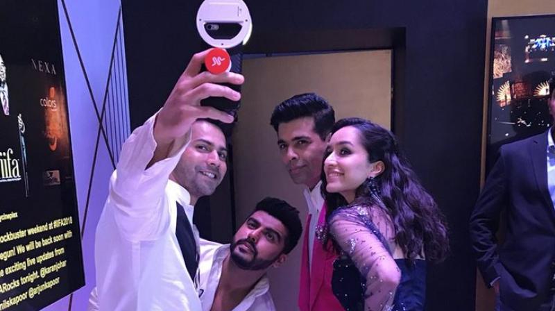 Varun Dhawan clicks a selfie with Arjun Kapoor, Karan Johar and Shraddha Kapoor at IIFA 2018.