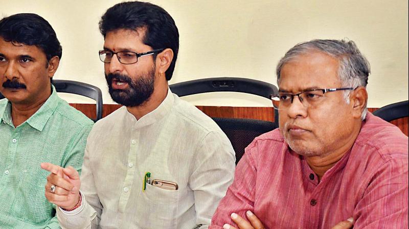 BJP leaders Suresh Kumar and C.T. Ravi address a press conference in Bengaluru on Thursday.