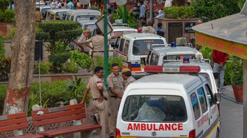 Ambulances carry the bodies of 11 family members, who were found hanging at their residence in Burari area, for cremation at Nigambodh Ghat, in New Delhi. (Photo: PTI)