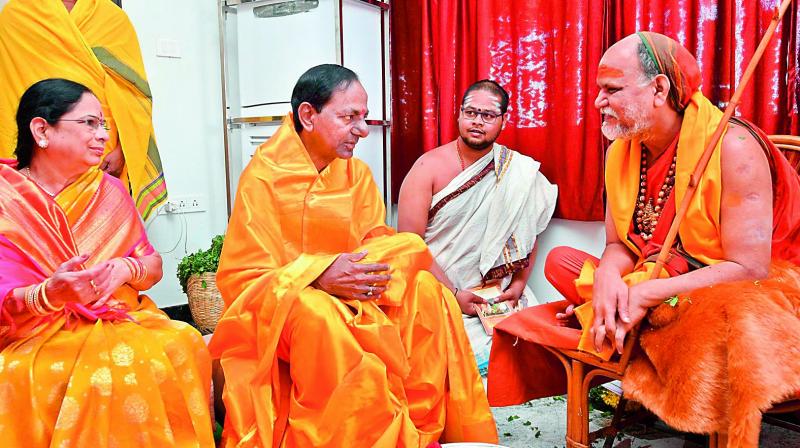 Chief Minister K. Chandrasekhar Rao along with his wife Shobha seeks the blessings of Swami Swaroopananda from Vizag peetham before the launch of the five-day Sahasra Maha Chandi Yagam at his farmhouse at Erravelli in Gajwel town of Siddipet district on Monday.