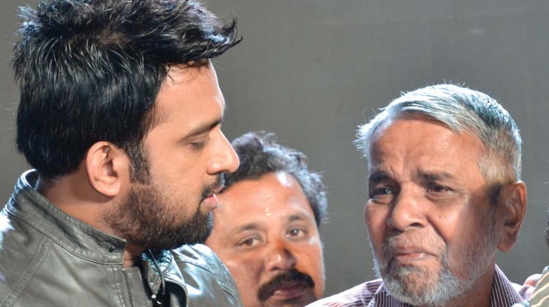 Late violinist Balabhaskars father C.K. Unni weeps before his sons close friend and musician Stephan Devassy during the inauguration of Balabhaskar Smruthi Geetham at Vyloppilli Sanskriti Bhavan on Monday