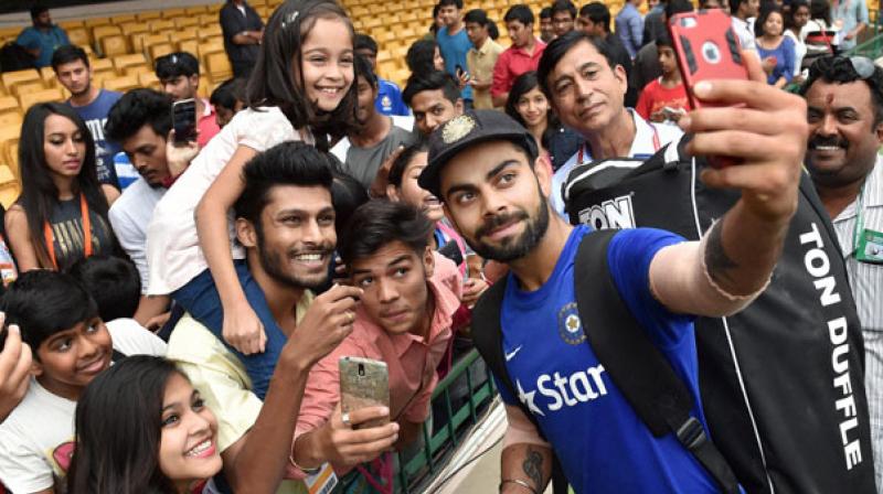 In a recent video Virat Kohli is seen not a big fuss of a security and meeting every single kid sitting on wheelchair and clicked selfies with them. (Photo:PTI)