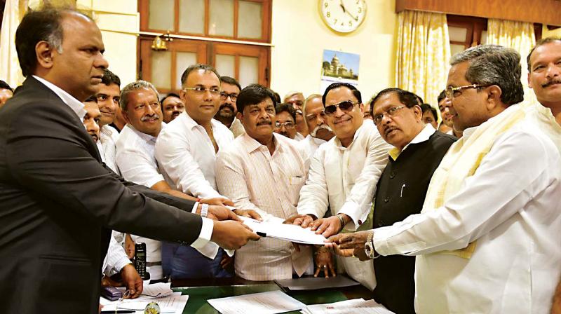 Congress leader C.M. Ibrahim submits nomination papers for MLC poll, in Bengaluru on Monday.