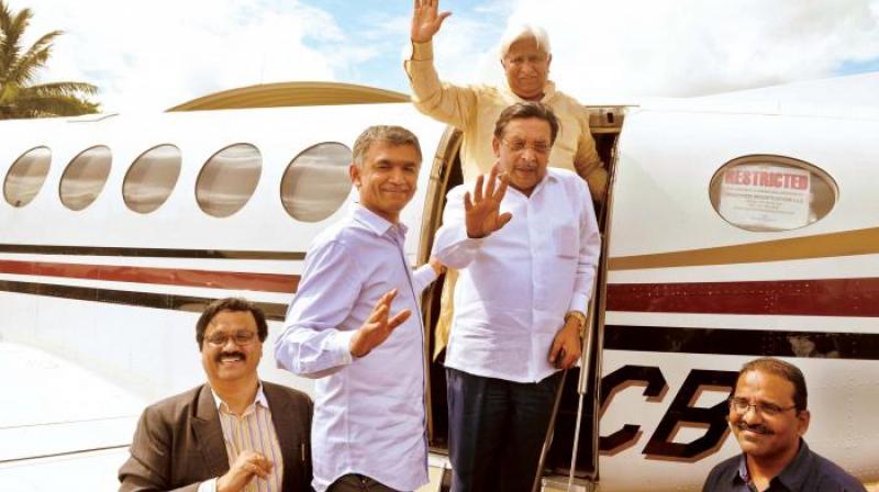 Ministers Krishna Byregowda, M.R. Seetharam and H.K. Patil board the cloud-seeding aircraft at Jakkur airfield in Bengaluru on Monday (Photo: DC)