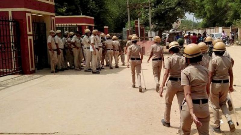 Police personnel maintain security at the Ryan International School in the view of protests in Gurugram on Sunday, two days after a 7-year-old class 2 student of the school was brutally murdered. (Photo: PTI)