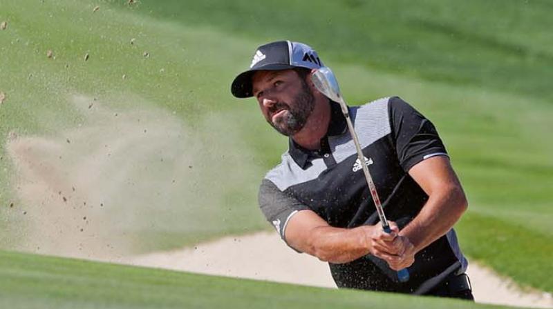 Spains Sergio Garcia comes out of a bunker during the third round of the Dubai Desert Classic at the Emirates Golf Club on Saturday (Photo: AFP)