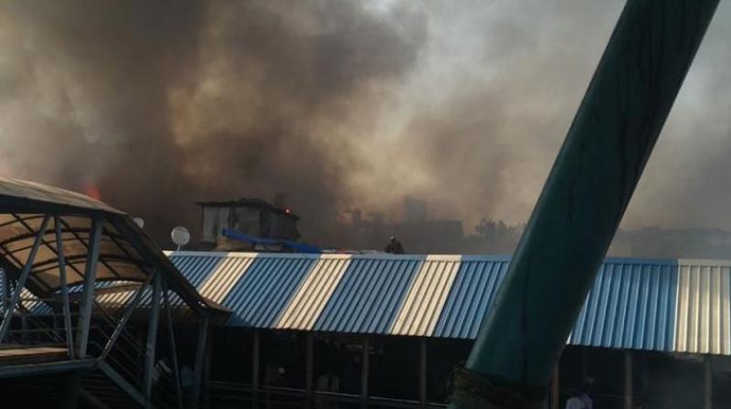 A massive fire broke out on Thursday in Behrampada near Bandra station. (Photo: ANI)