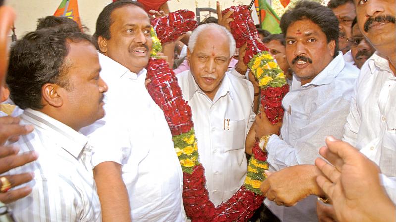 Former chief minister and BJP state president B.S. Yeddyurappa being greeted by his supporters at the BJP office in Bengaluru after the CBI court gave him a clean chit.