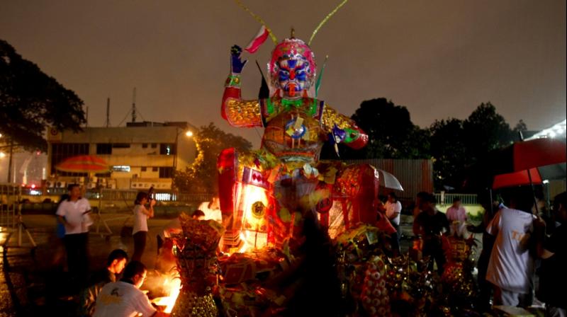 Spirits come to feast as gates of Hell open at the ancient Hungry Ghost Festival