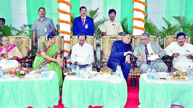 Governor E.S.L. Narasimhan (second from right) speaks to Hyderabad High Court Chief Justice Thottathil B. Radhakrishnan (right) while Chief Minister K. Chandrasekhar Rao (second from left) listens to Vimala Narasimhan (left) during the At Home hosted the Governor at Raj Bhavan on Wednesday. (Photo: DC)