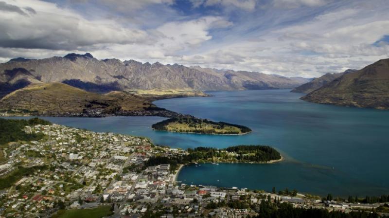Views like this -- of Queenstown and Lake Wakatipu, with the Remarkables mountain range in the background -- are one of the reasons tourists flock to New Zealand. But strong economic growth is placing strains on the environment, the OECD is warning