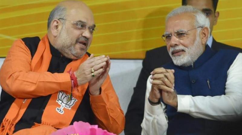 Prime Minister Narendra Modi and BJP President Amit Shah at a felicitation function before the partys parliamentary board meeting in New Delhi.