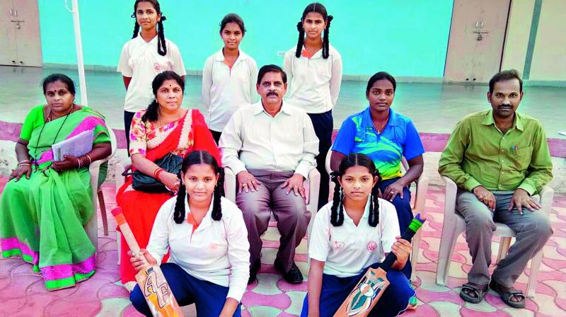 Girl students along with school principal and coach of Navodaya Vidyalaya-2 in Prakasam on Wednesday. (Photo: DC)