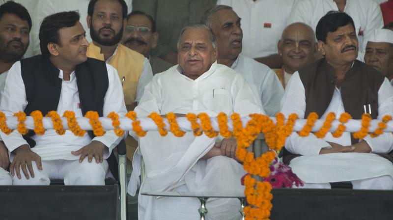 Samajwadi Party president Mulayum Singh Yadav, center, Uttar Pradesh Chief Minister Akhilesh Yadav, left, and party leader Shivpal Singh Yadav, right. (Photo: AP)