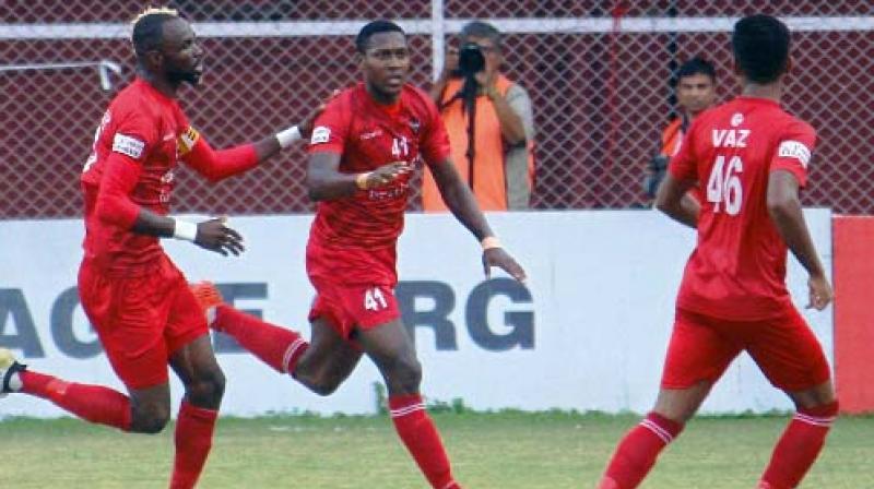 Churchill Brothers Mechac Koffi (right) celebrates after scoring in their I-League match against Aizawl FC in Margao on Tuesday. Churchill won 1-0.
