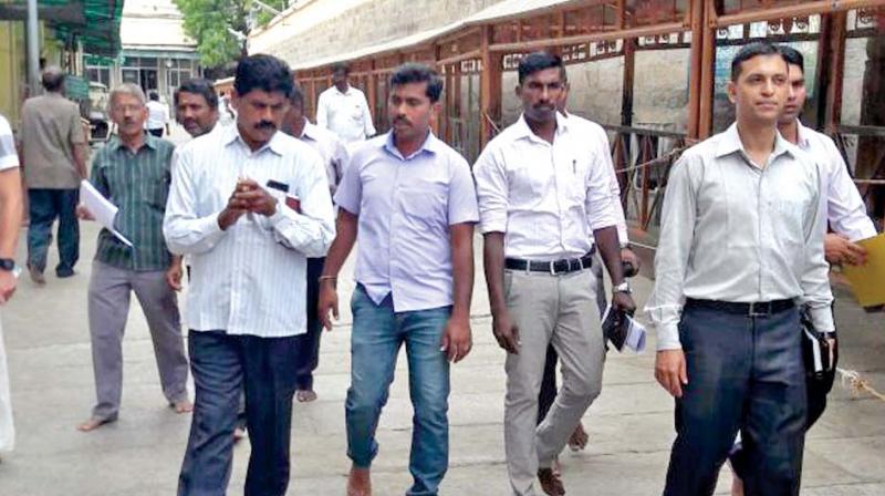 National Investigation Agency team inspects the Meenakshi Amman temple at Madurai on Tuesday. (Photo: DC)