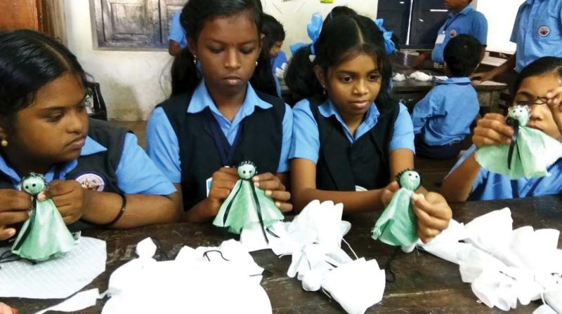 Students engaged in making soft doll KeMi