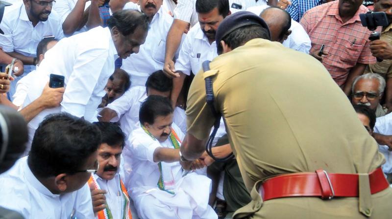 Opposition Leader Ramesh Chennithala being arrested by the police after the UDF laid siege to the Secretariat on Wednesday in protest against the LDF Governments apathy to flood victims. Also seen are V. S. Sivakumar, MLA, and KPCC general secretary T. Saratchandra Prasad.    (A.V. MUZAFAR)