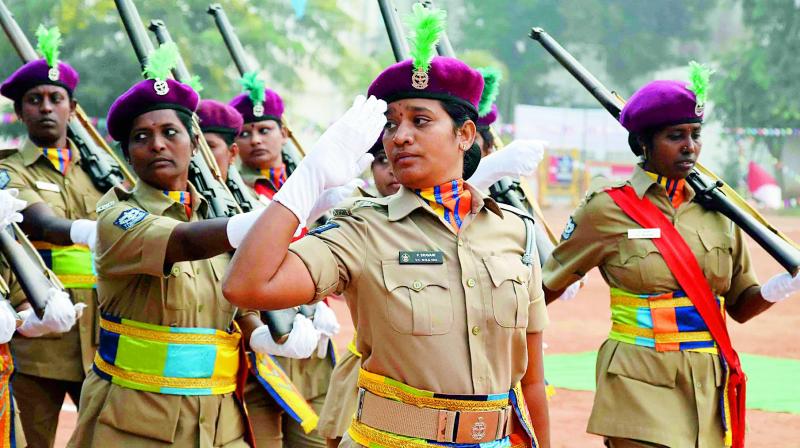 Home Guards march past at the IGMC stadium in Vijayawada during the Formation Day celebrations on Thursday. 	 DC