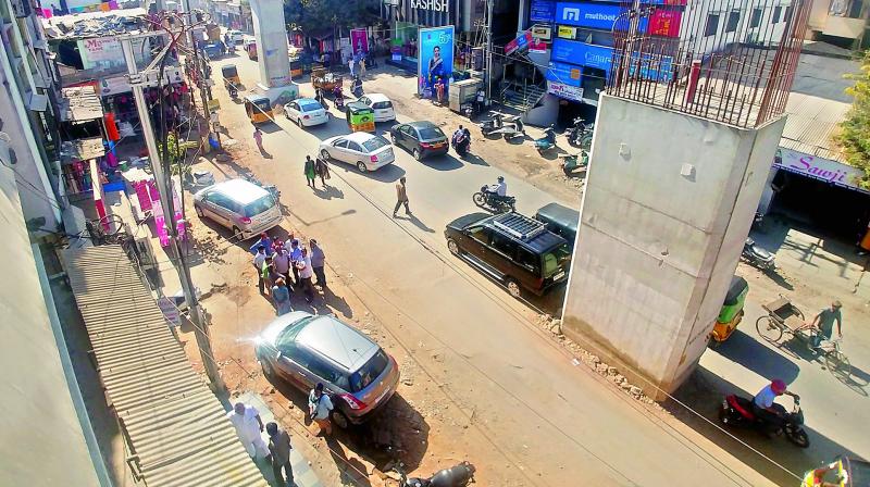 The road at Badi Chowdi in Kachiguda has been dug up to lay water and drainage pipes. Dust from the road has been causing inconvenience to  shopkeepers in the area. DC