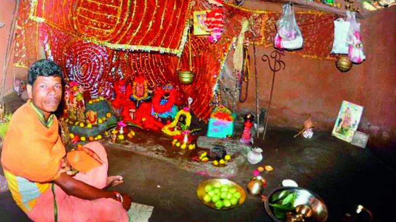 A priest performs puja praying for recovery of Japanese Encephalitis-affected children in Malkangiri district of Odisha. (Photo: DC)