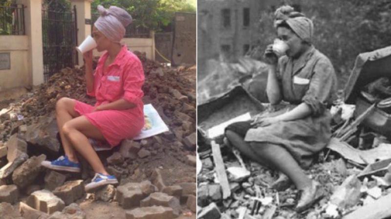 Alves along with her 16-year-old daughter decided to replicate an iconic photograph from World War II by sitting on top of the rubble on St. Pauls Road. (Photo: Twitter/BookOfGenesia)