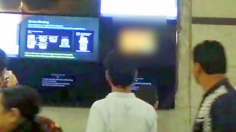 A tv grab of the pornographic clip being played on an LED screen at Rajiv Chowk Metro Station in Delhi.