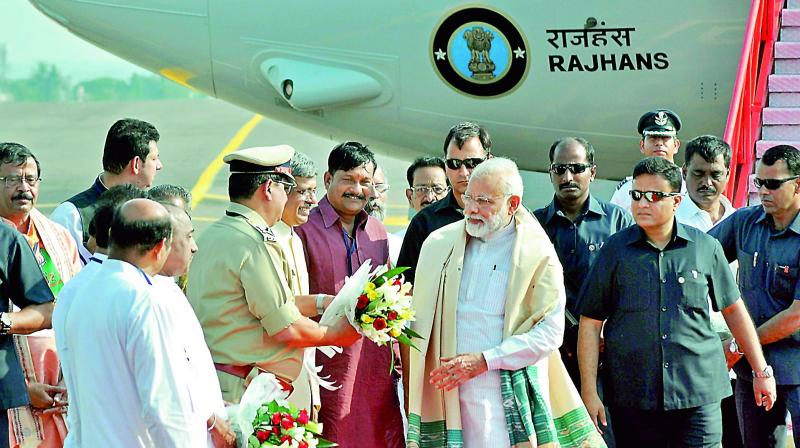Prime Minister Narendra Modi being welcomed by party leaders upon his arrival at Biju Patnaik Airport, in Bhubaneswar on Saturday. (Photo: PTI)