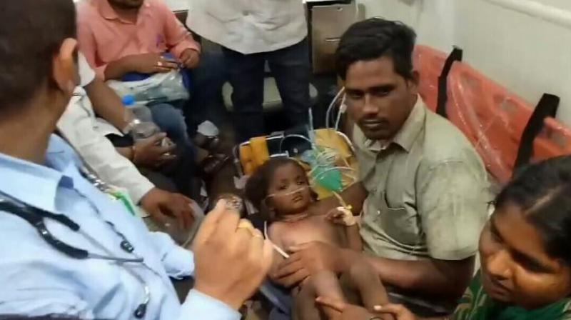 Parents of Anamaluru Chandra Sekhar (Chandu), who fell in a borewell on Tuesday, thanked officials and NDRF for their efforts in bringing out boy alive. (Photo: Venu Lanka)