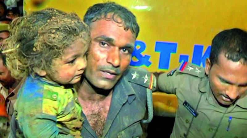Two-year-old A. Chandrasekhar after being rescued on Wednesday.  	(Photo:DC)