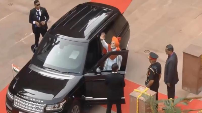 In the video, Prime Minister Narendra Modi can be seen waving is hand before sitting on the navigator seat of his SUV and wearing his seat belt. (Photo: Twitter | @PIB_India)