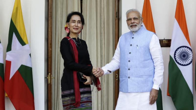 Prime Minister Narendra Modi, right, shakes hand with Myanmars Foreign Minister Aung San Suu Kyi before a bilateral meeting in New Delhi. (Photo: AP)