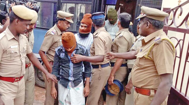 The accused in the pipe bomb case being brought to a police station in Madurai on Friday (Photo: DC)