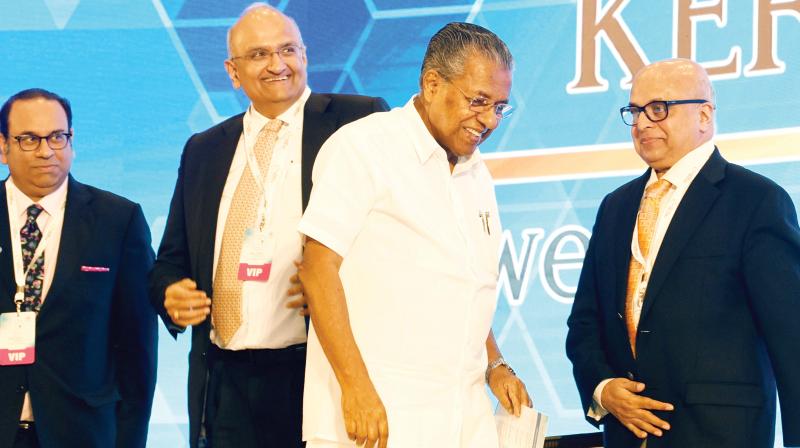 Chief Minister Pinarayi Vijayan arrives at the inauguration of ASCEND Kerala 19 summit in Kochi on Monday. FICCI president Sandip Somany, CII chairman R Dinesh and Chief secretary Tom Jose  are also seen.   (ARUN CHANDRABOSE)