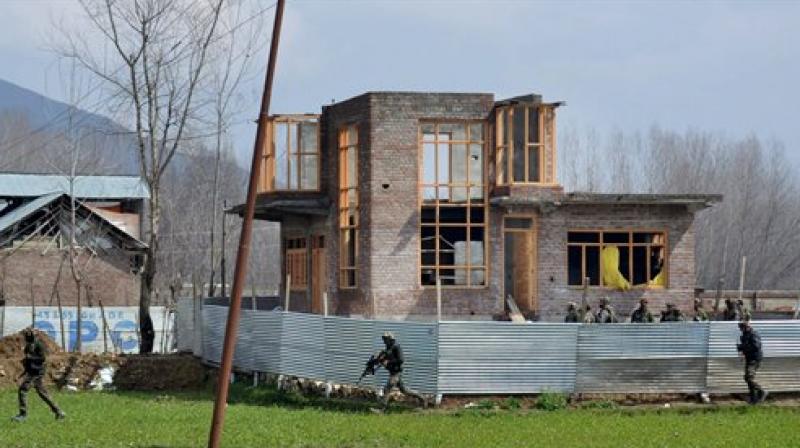 Army personnel near the house where two Lashkar-e-Toiba (LeT) militants were hiding, during an encounter at Padgampora village in Awantipora, in Pulwama. (Photo: PTI)