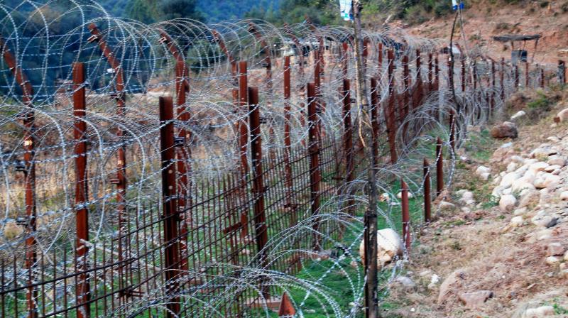 Indian Army Soldiers stand guard near the Line of Control (LoC) in Poonch after One person was killed and many others injured in cross border firing between Indian and Pakistani troops on Thursday. (Photo: PTI)