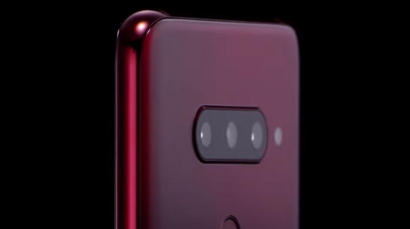 The video shows off a trio of rear cameras and a dual-camera setup for shooting selfies. (Photo: LG V40 ThinQ)