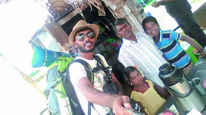 Vimal with a family which gave him free food and shelter for a night