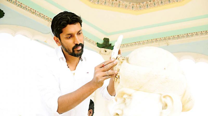 Sculptor Arun Yogiraj Shilpi works on the statue of Nalwadi Krishnaraja Wadiyar.