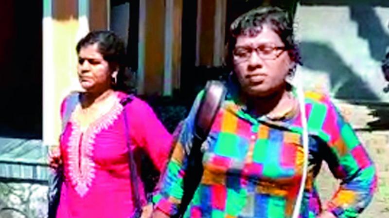 Kerala government employee Kanakadurga (left) and Prof. Bindu Ammini at Angamaly from where they were taken to their native place after having a darshan on Wednesday (Photo: DC)