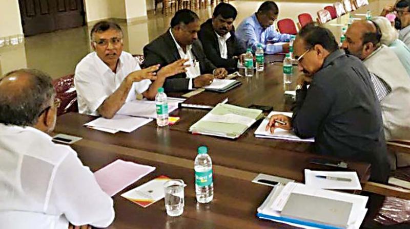 At the meeting, the officials decided to share the space and revenues of the 115-seater Jnana Jyothi Auditorium, which is rented out for public events.