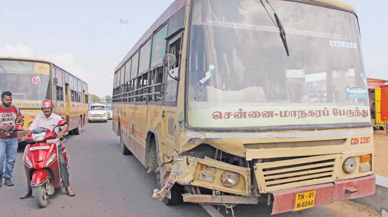 The MTC bus and the call taxi (top) that collided head-on on Kamaraj Salai  on Friday. (Photo: DC)