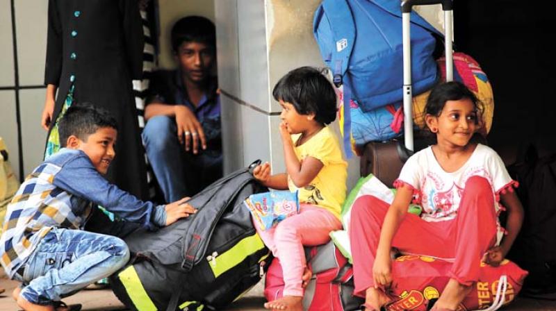 A group of children play after they got stuck with their families at Kozhikode Railway station on Thursday.   (Photo:  DC)