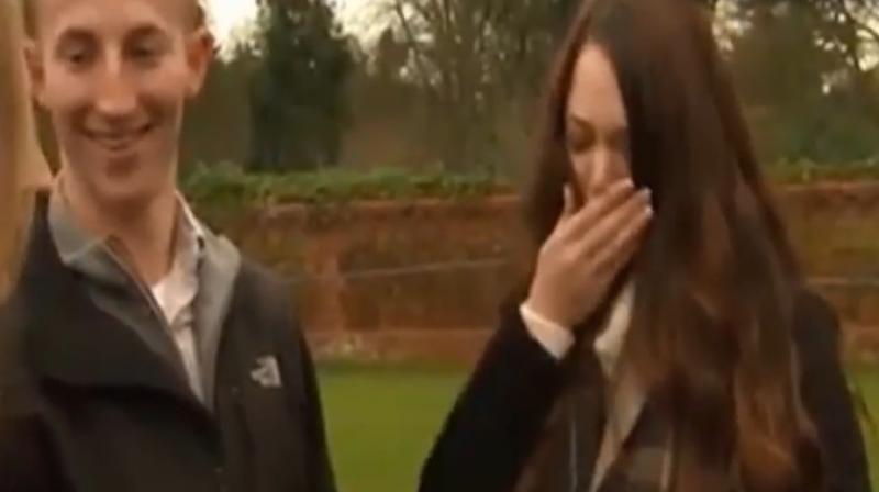 The girl was overwhelmed as she fought back tears to say yes and took the ring from the white box (Photo: YouTube)
